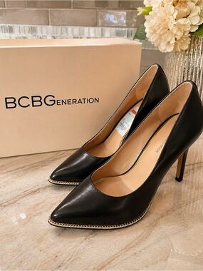 BCBGeneration Black Pointed Toe Pumps with Gold Chain Trim